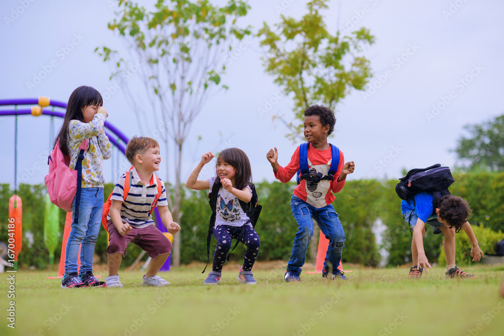 kids preschool kindergarten enjoy and happy jumping on the field of playground after school class is over to retuning home kids preschool kindergarten enjoy and happy jumping on the field of playground after school class is over to retuning home