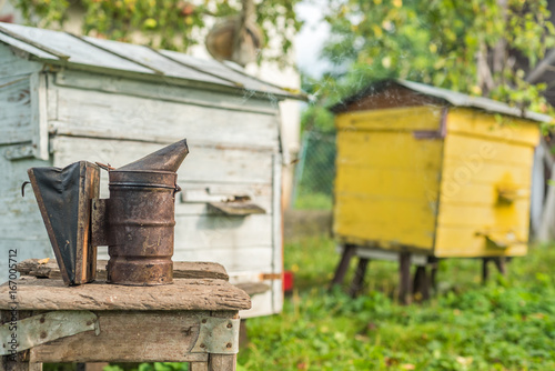 Beekeeping equipment - bee smoker, process of obtaining honey, own safety © dero2084