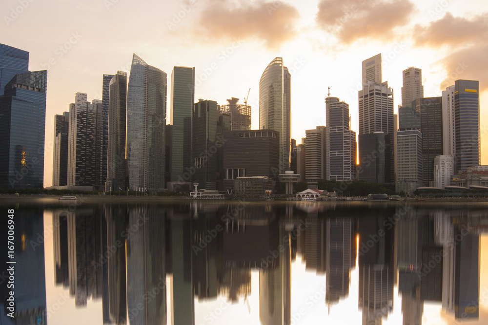 Singapore office buildings business district at dusk.