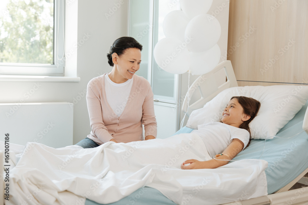 Obraz premium Happy positive mother visiting her daughter