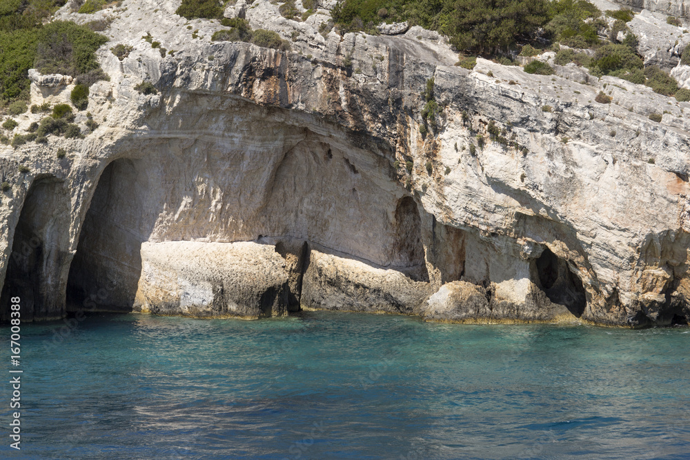 Blue water seascape with limestone caves 