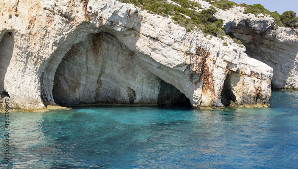 Blue water seascape with limestone caves 