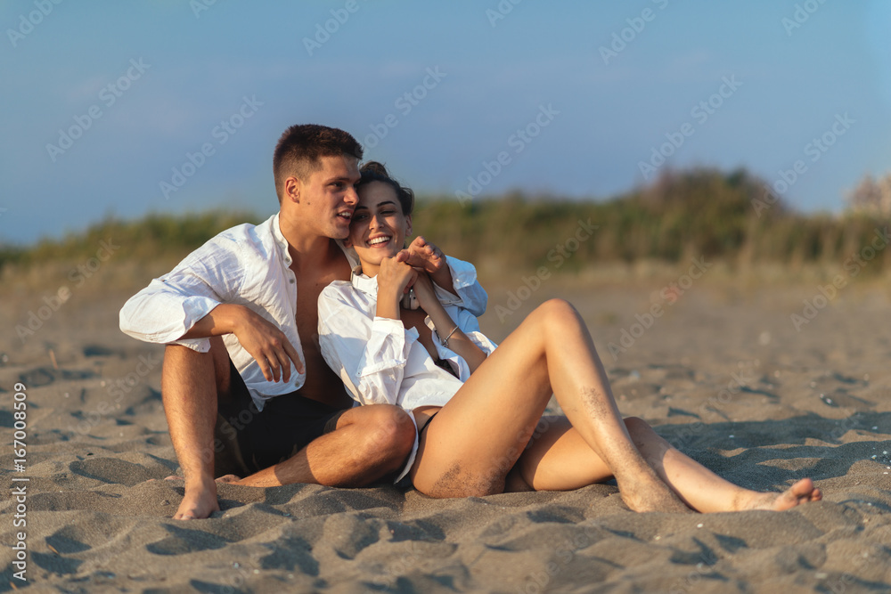 Young couple in love on the beach Young couple in love on the beach