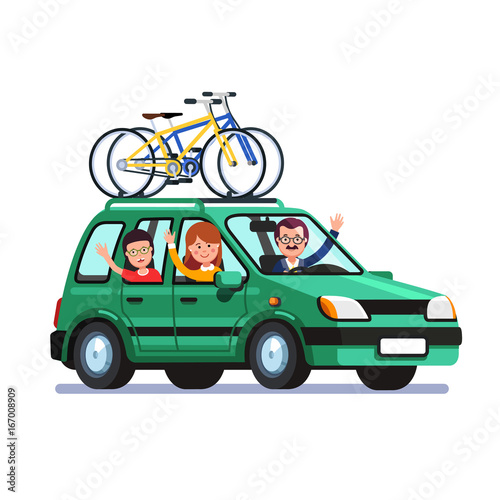 Family traveling by car with bicycles on the roof