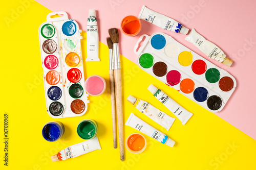 Paints brushes pencils paper colors mock up