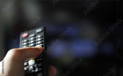 Foto Flicking through TV channels with remote