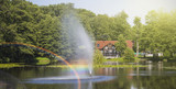 beautiful fountain and rainbow on a lake