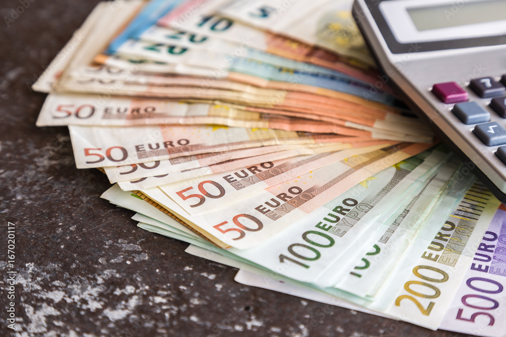 Euro money with calculator on the table. Happy salary day. Money  background. Stock Photo | Adobe Stock