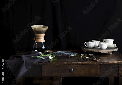 Filter coffee and cups and saucers on a sideboard