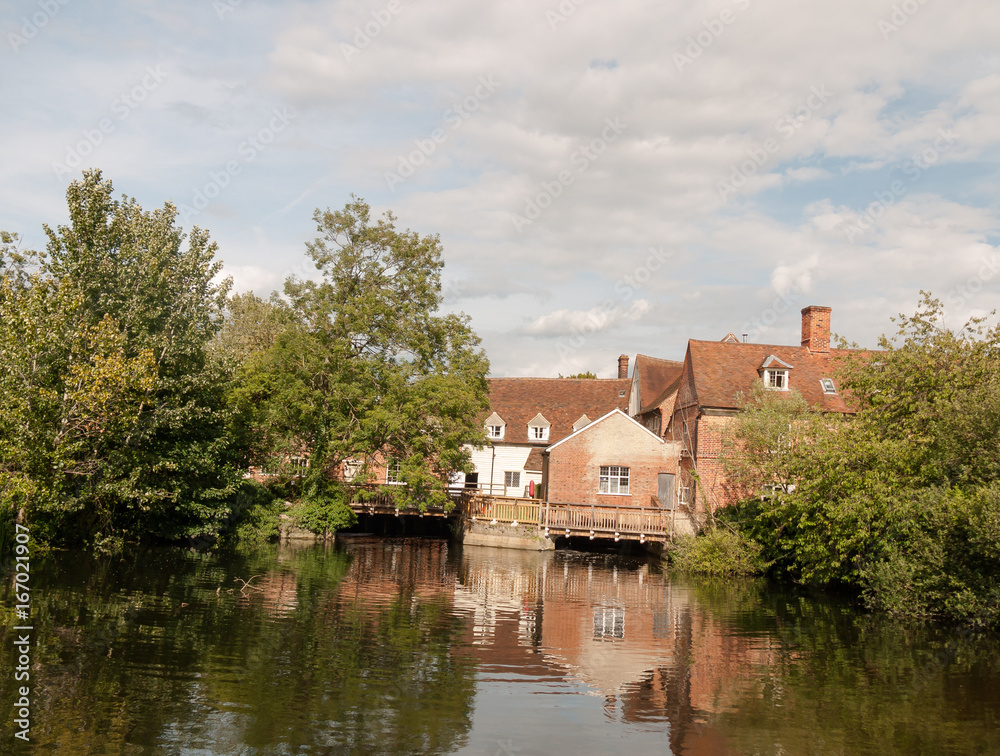 a river cottage scene in summer light in flatford mill near dedham in constable country