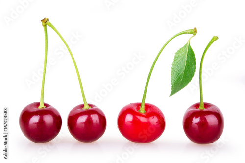 Four ripe red cherries