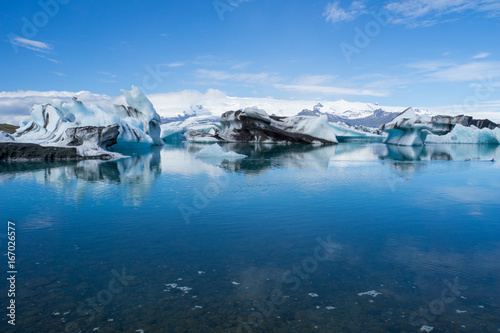 Iceland - Giant ice floes on joekulsarlon glacier lagoon with blue sky