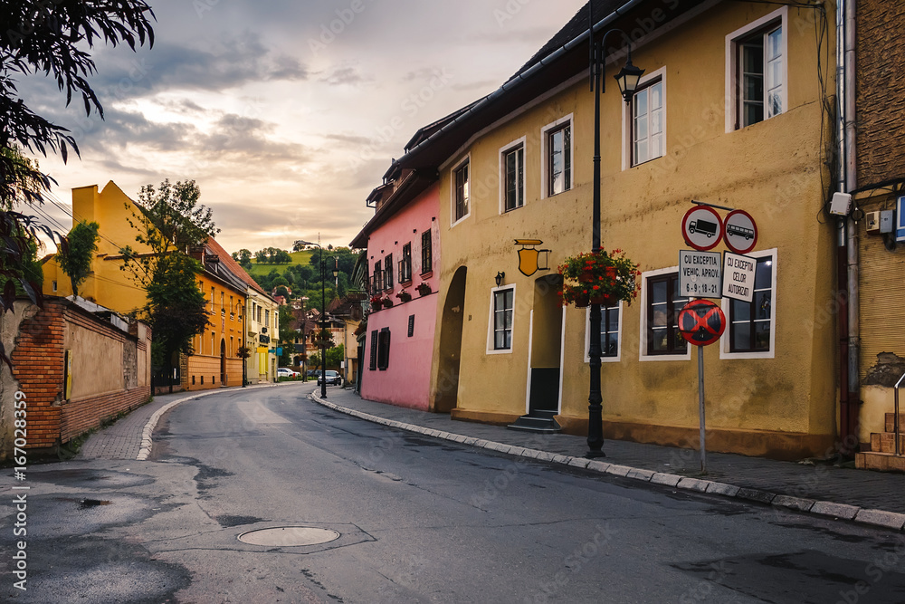 Obraz premium Street with houses in old european city Sighisoara at Romania