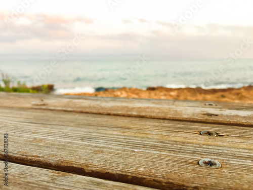 Wooden bench on sea background. Summer background