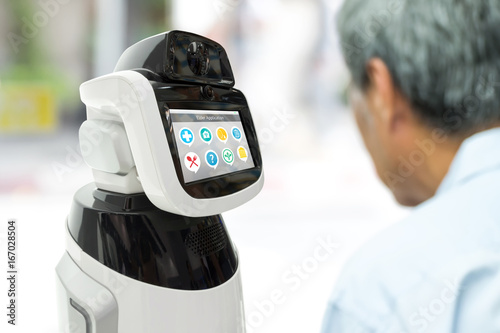 Robot Assistant healthcare helping elder with application. Artificial intelligence (ai) , robot adviser assistant technology concept.