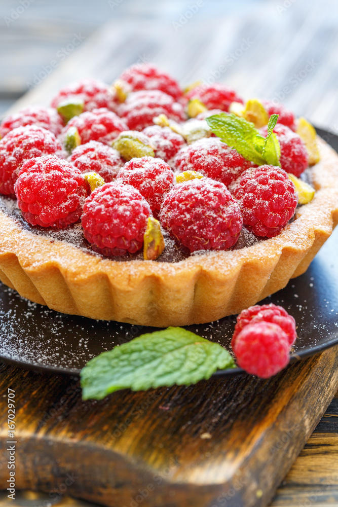 Tartlet with chocolate ganache and raspberries. Tartlet with chocolate ganache and raspberries.