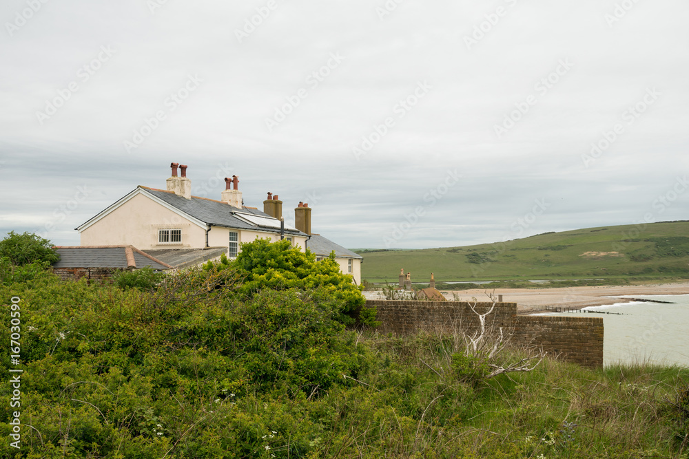 Cottages sulla foce del fiume Cuckmere, Seven Sisters Country Park - Sussex, Inghilterra