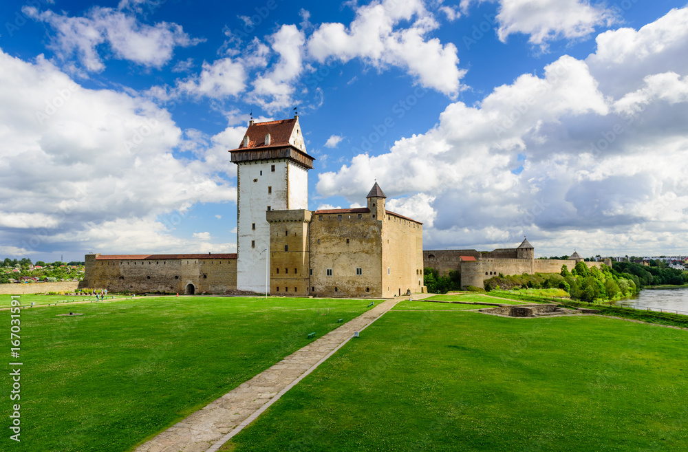 Beautiful summer view of Narva Castle with tall Herman's tower, Narva, Estonia.
