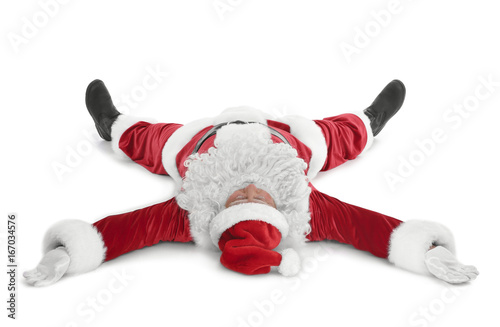 Happy authentic Santa Claus lying against white background