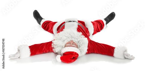 Happy authentic Santa Claus lying, isolated on white