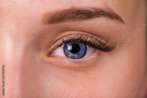 Female eye with long eyelashes close up