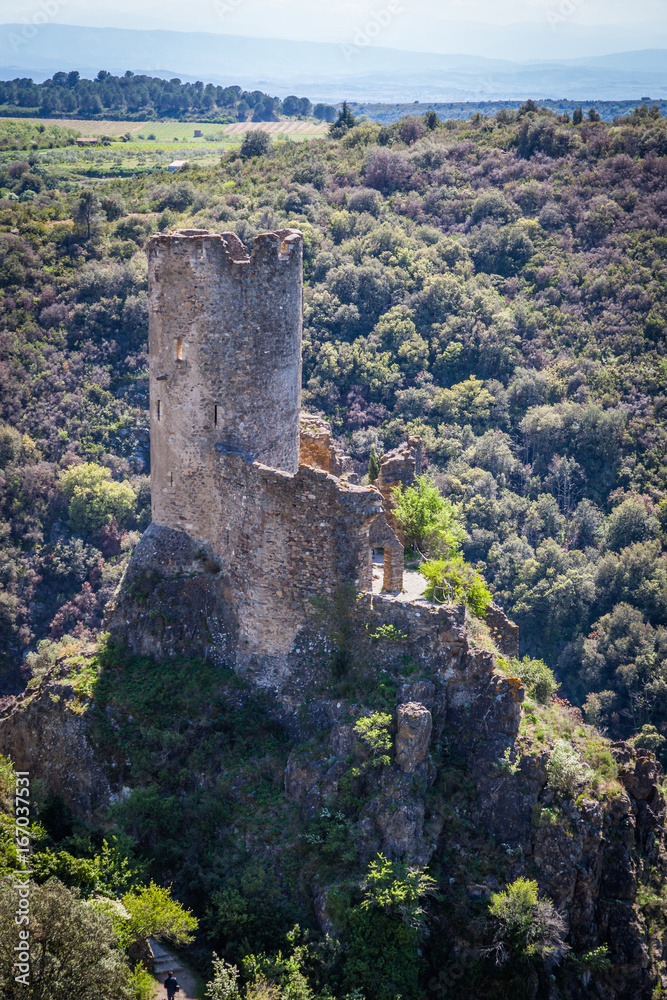 Lastrous castle in France on top of the mountain on a sunny day with forest view