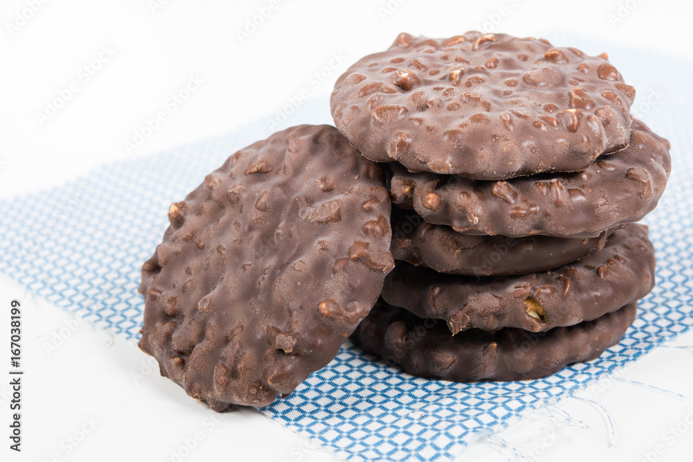Fototapeta premium Stack of chocolate nut cookies on raw material