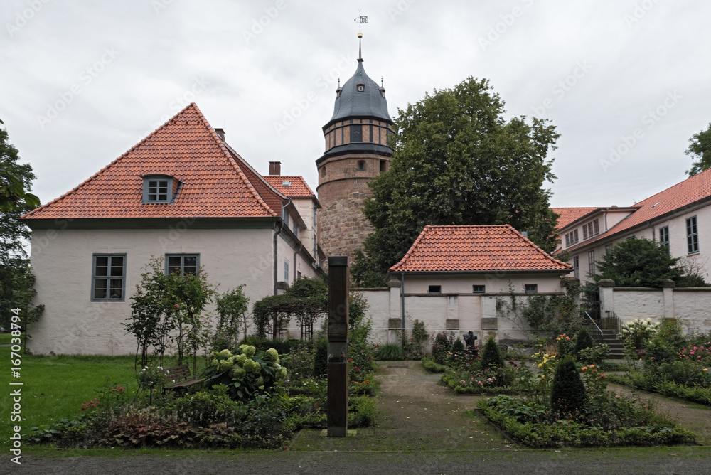 Fototapeta premium The Diepholzer castle with tower and roses garden