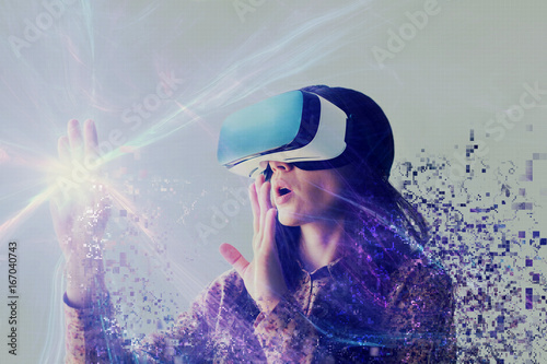 A person in virtual glasses flies to pixels. The woman with glasses of virtual reality. Future technology concept. Modern imaging technology. photo