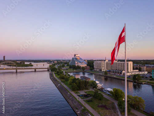 Beautiful aerial sunset view over AB dam in Riga Latvia with a huge Latvian flag photo