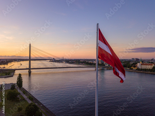 Beautiful aerial sunset view over AB dam in Riga Latvia with a huge Latvian flag photo