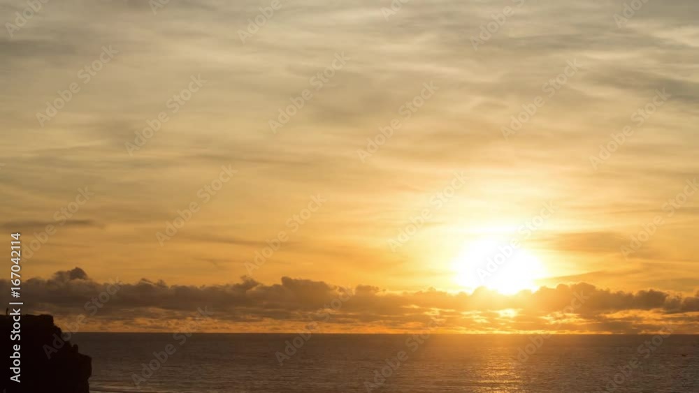 Sun rays passing through the waves of flush or low tide on the ocean coast. Beautiful red and yellow reflections in the water. Holidays destination. Nature background. Zoom in view from sea beach. Sun rays passing through the waves of flush or low tide on the ocean coast. Beautiful red and yellow reflections in the water. Holidays destination. Nature background. Zoom in view from sea beach.