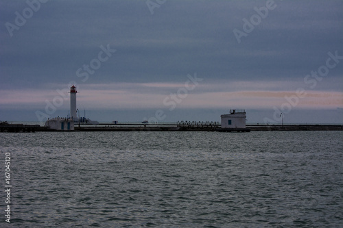 Lighthouse at the entrance to the seaport of Odessa in the evening of July 12, 2017