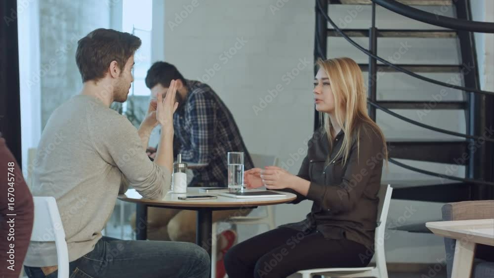 Young couple have first date together in cafe Young couple have first date together in cafe