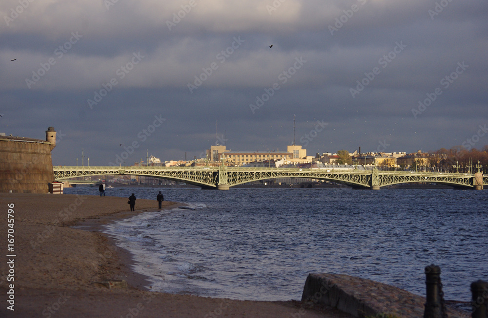 Waves on the Neva River and Trinity Bridge in St. Petersburg.
