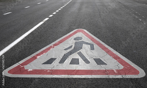 Traffic sign Caution Pedestrian crossing painted on asphalt road © fifg