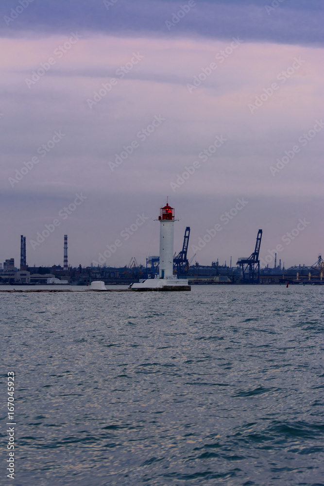 Lighthouse at the entrance to the seaport of Odessa in the evening of July 12, 2017