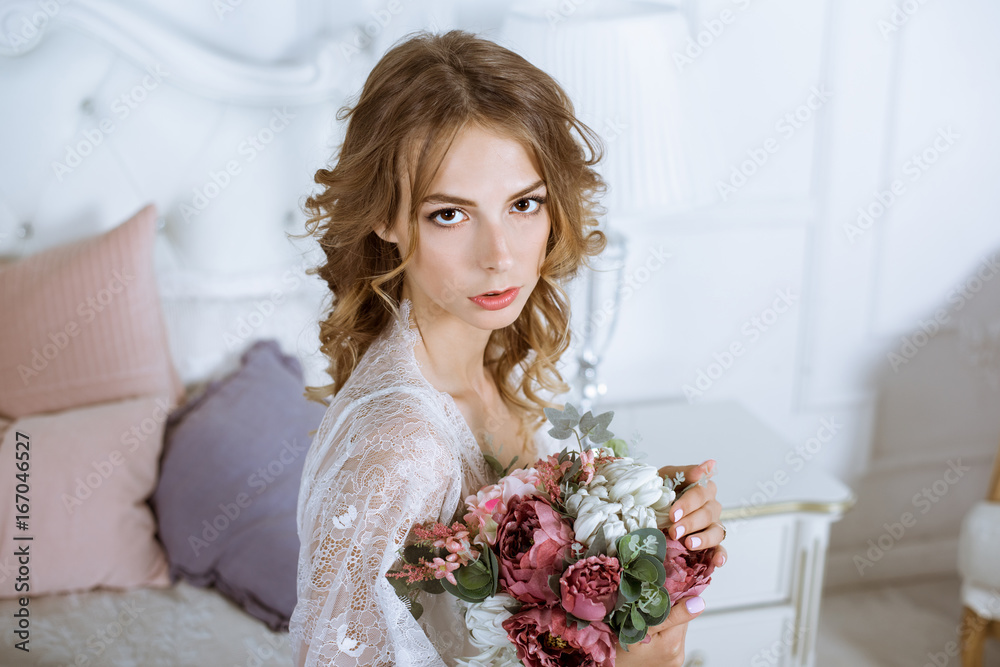 Fashionable female portrait of cute lady in white robe indoors Fashionable female portrait of cute lady in white robe indoors