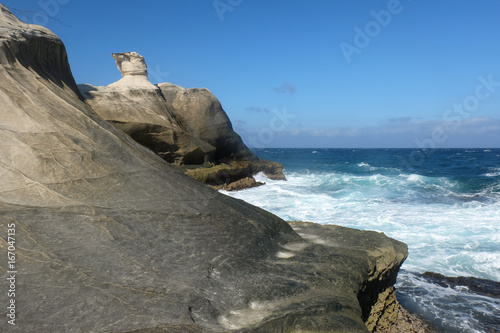Limestone Kapurpurawan rock formation in Ilocos Norte, Philippines photo