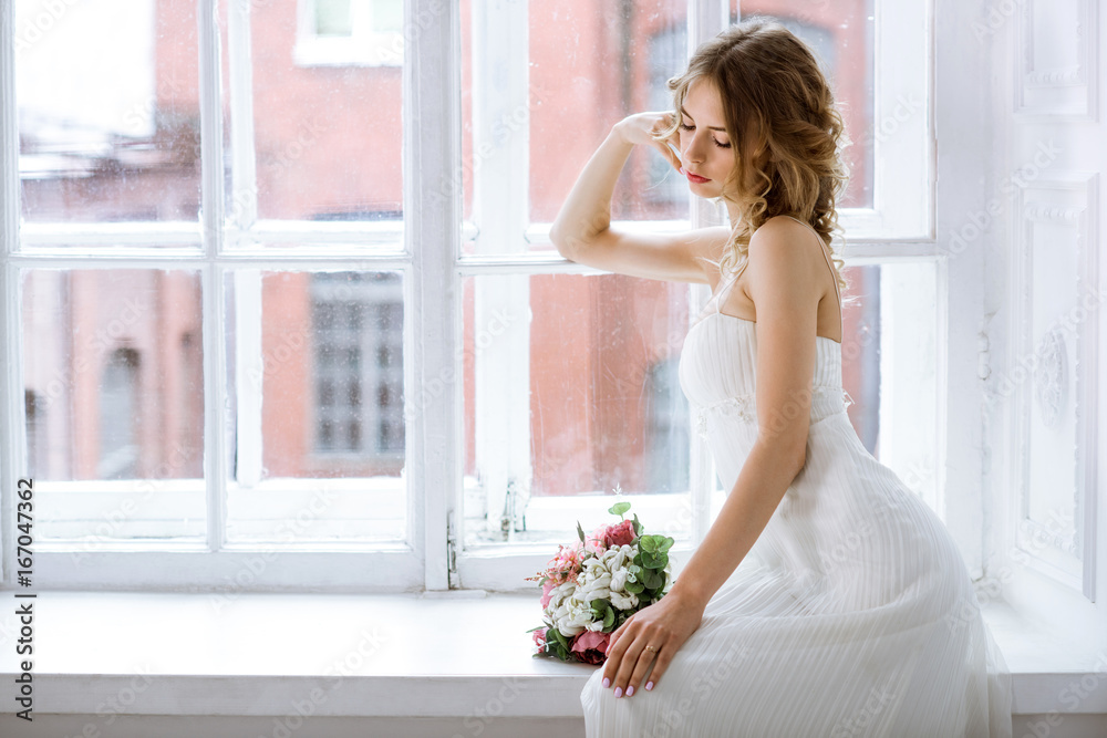 Brunette bride in fashion white wedding dress with makeup Brunette bride in fashion white wedding dress with makeup