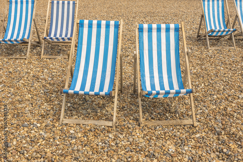 Striped beach chairs waiting tourists Striped beach chairs waiting tourists