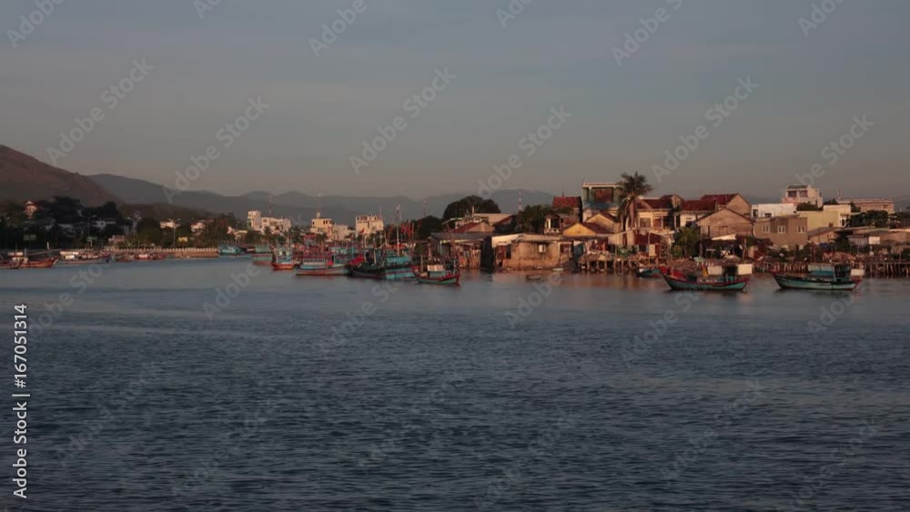 Vietnamese wooden fishing boats on the cai river used as a harbour, riverside time lapse high definition clip. Vietnamese wooden fishing boats on the cai river used as a harbour, riverside time lapse high definition clip.