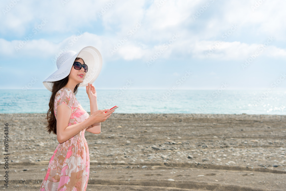 young woman wearing the dress visiting the beach young woman wearing the dress visiting the beach