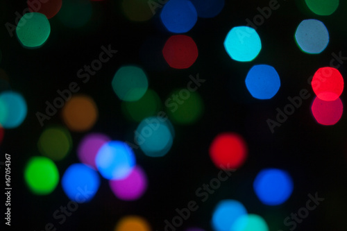 Abstract background of out of focus lights at night. Light hexagon.