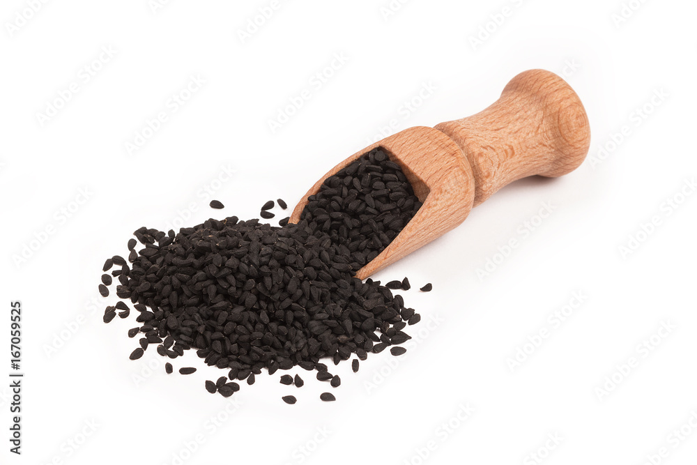 Black cumin seed in wooden scoop isolated on white background. Top view, Nigella sativa Black cumin seed in wooden scoop isolated on white background. Top view, Nigella sativa