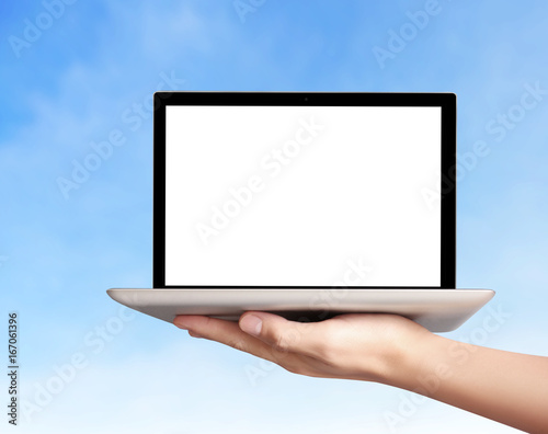 male hand holding  laptop