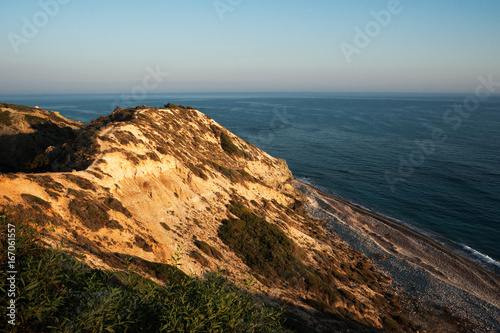 Sunrise in the sea from the rock. Sunset over the sea from the rock. Seascape. Mediterranean sea. Beautiful sunset. Mountains by the sea. The Nature Of Cyprus. The Nature Of Greece