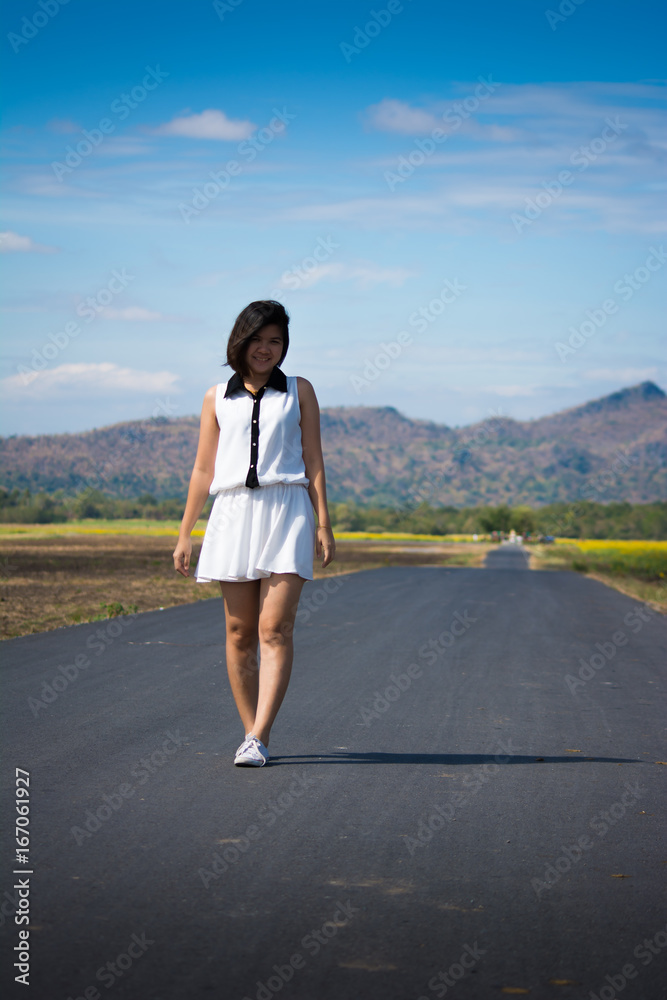 woman walking alone on the road woman walking alone on the road