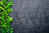 Parsley. On a wooden background. Top view. Free space for your text.