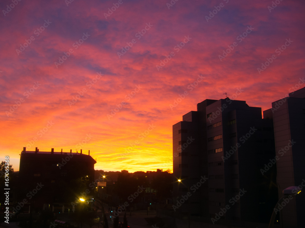 Amazing colours clouds at sunrise in Madrid city, Spain